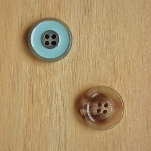 Botón fantasía de plástico de 22 mm